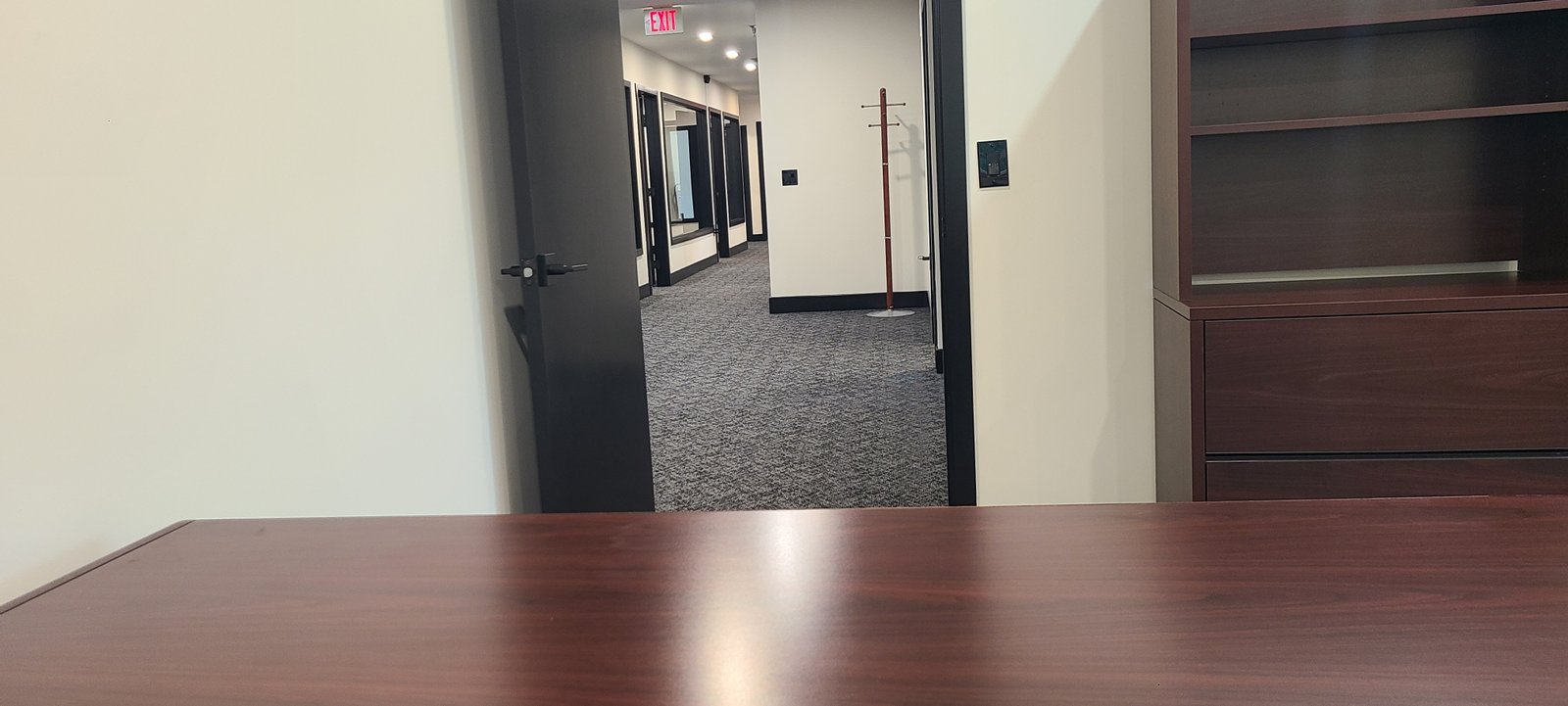 Office view with storage wall
